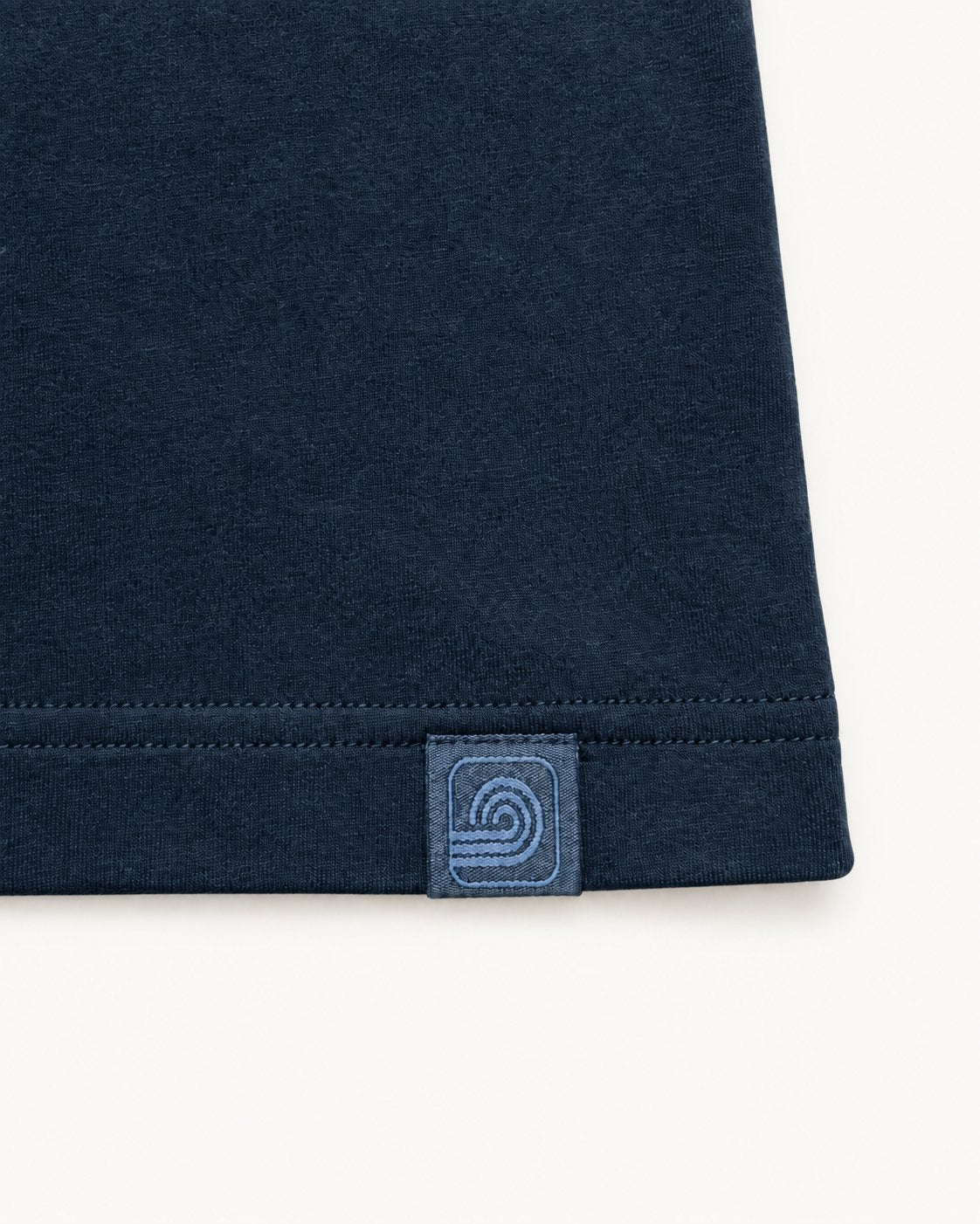 Black Futurum Youth T-shirt — woven emblem and double-stitched hem detail