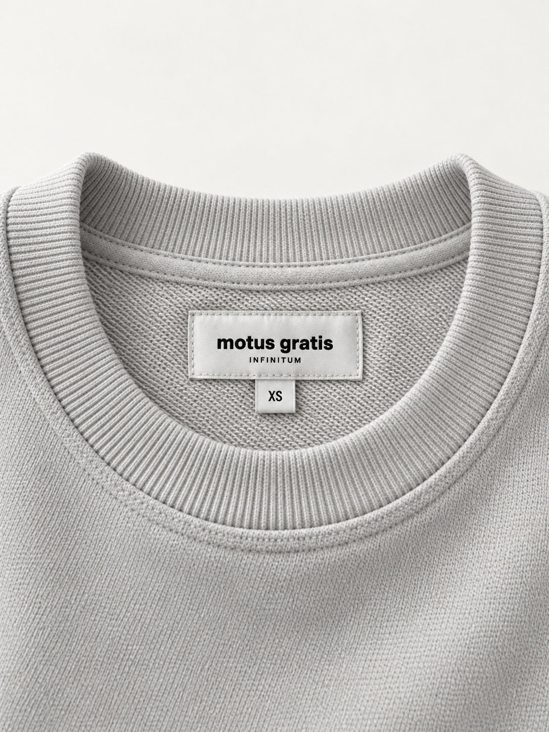 Infinitum Cloud Gray sweatshirt — neck label