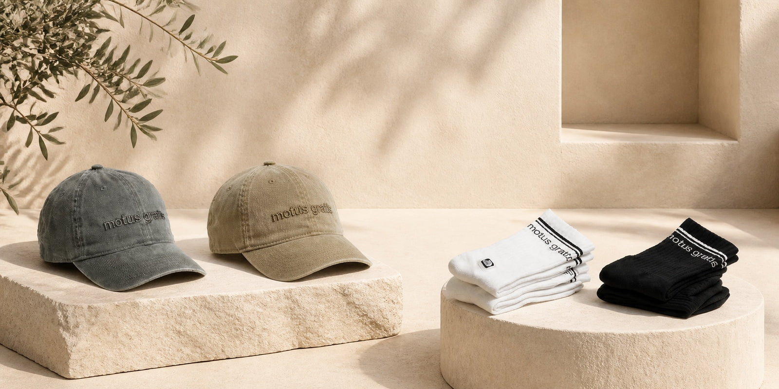 Motus Gratis caps and socks, desktop accessories homepage hero