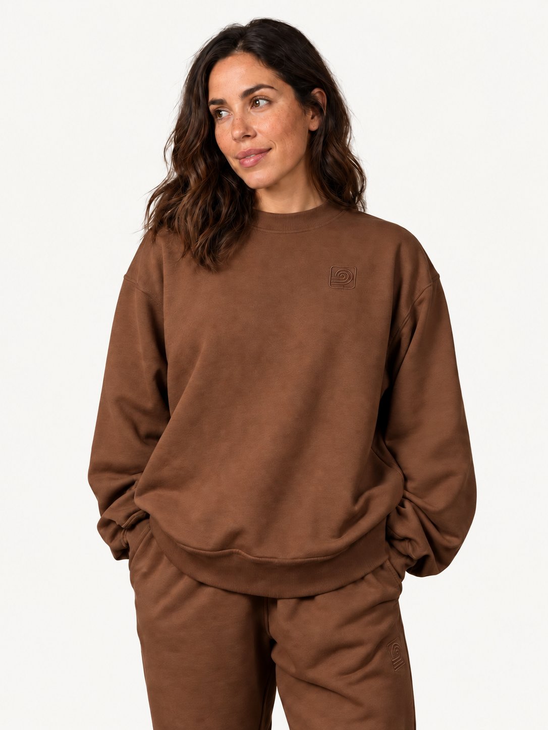 Women's brown Infinitum sweatshirt on fashion model — three quarter