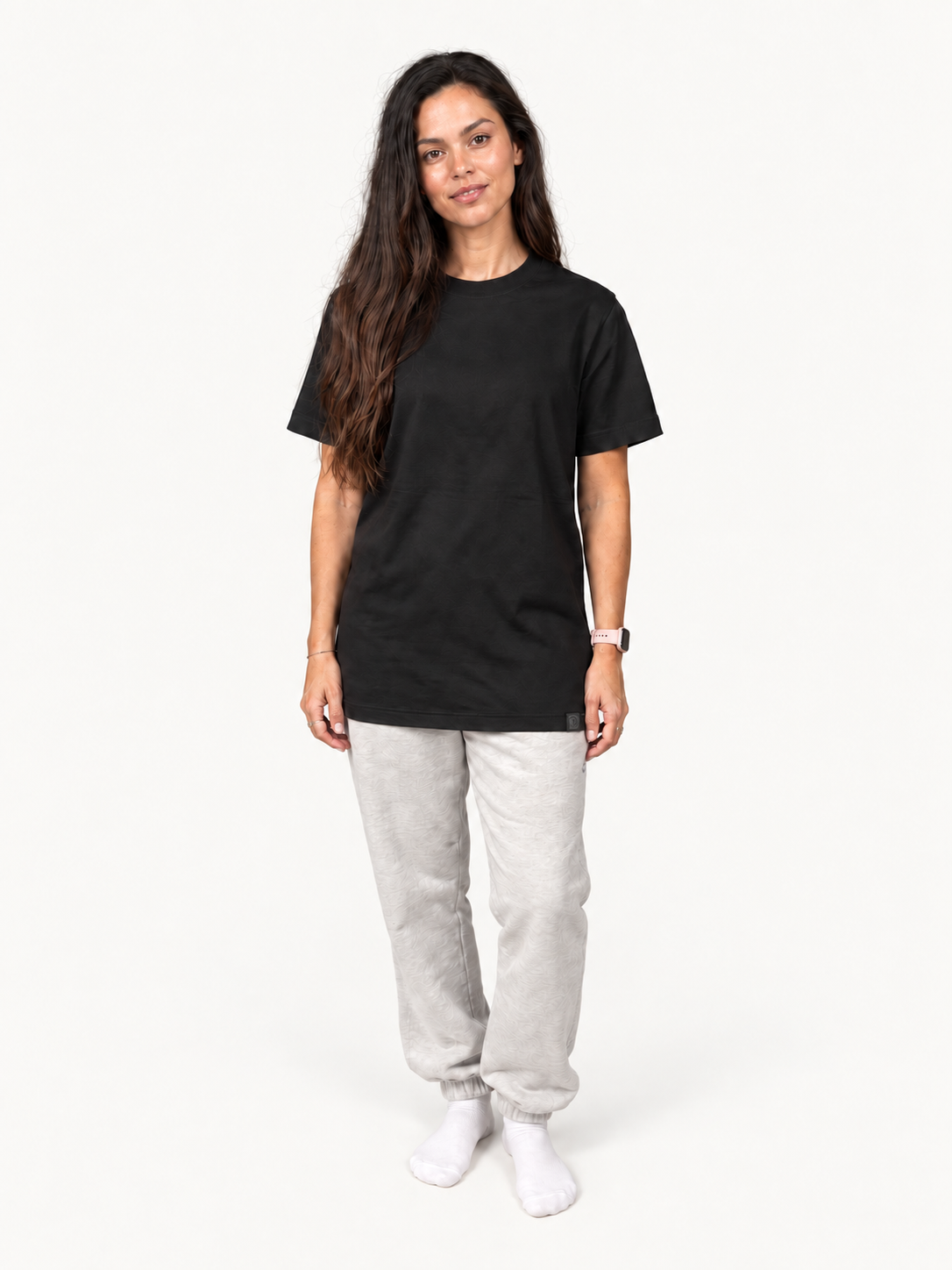 Black Moderni T-shirt on model, full length untucked with woven hem label