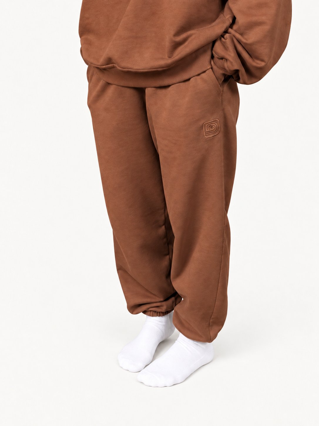 Women's brown Pura sweatpants — fashion model wearing size S — front
