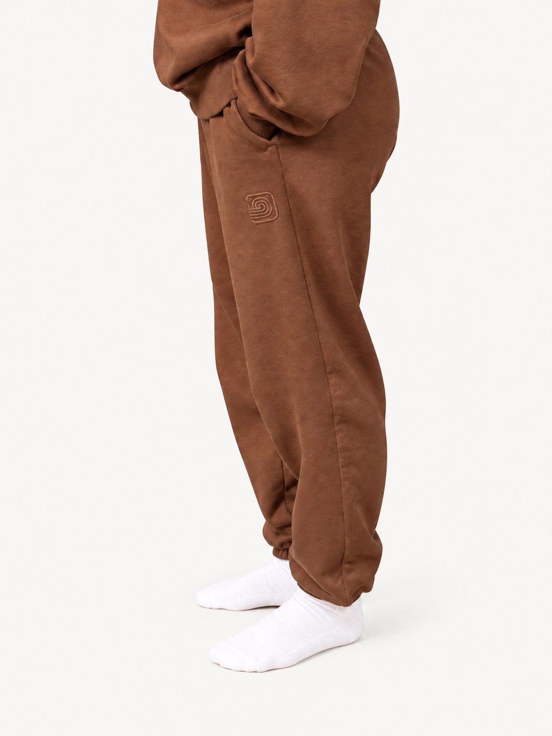 Women's brown Pura sweatpants — fashion model wearing size S — side