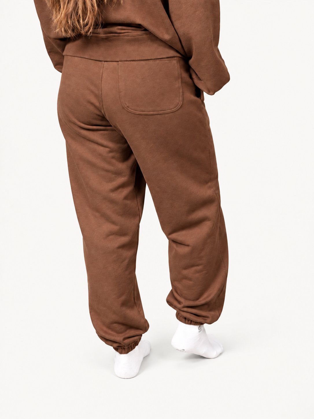 Women's brown Pura sweatpants — fashion model wearing size S — back